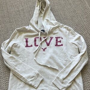 American Eagle Outfitters Cream Hoodie with Purple Print